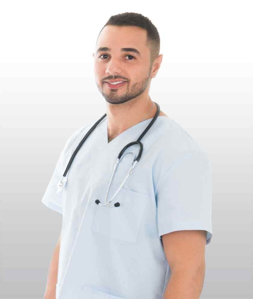 A healthcare professional in scrubs with a stethoscope around his neck smiling at the camera.